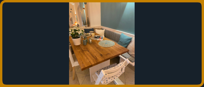 Sitzecke bestehend aus Tisch und Eckbank in einer Kombi aus weiß lackiert und Eiche massiv Tischplatte